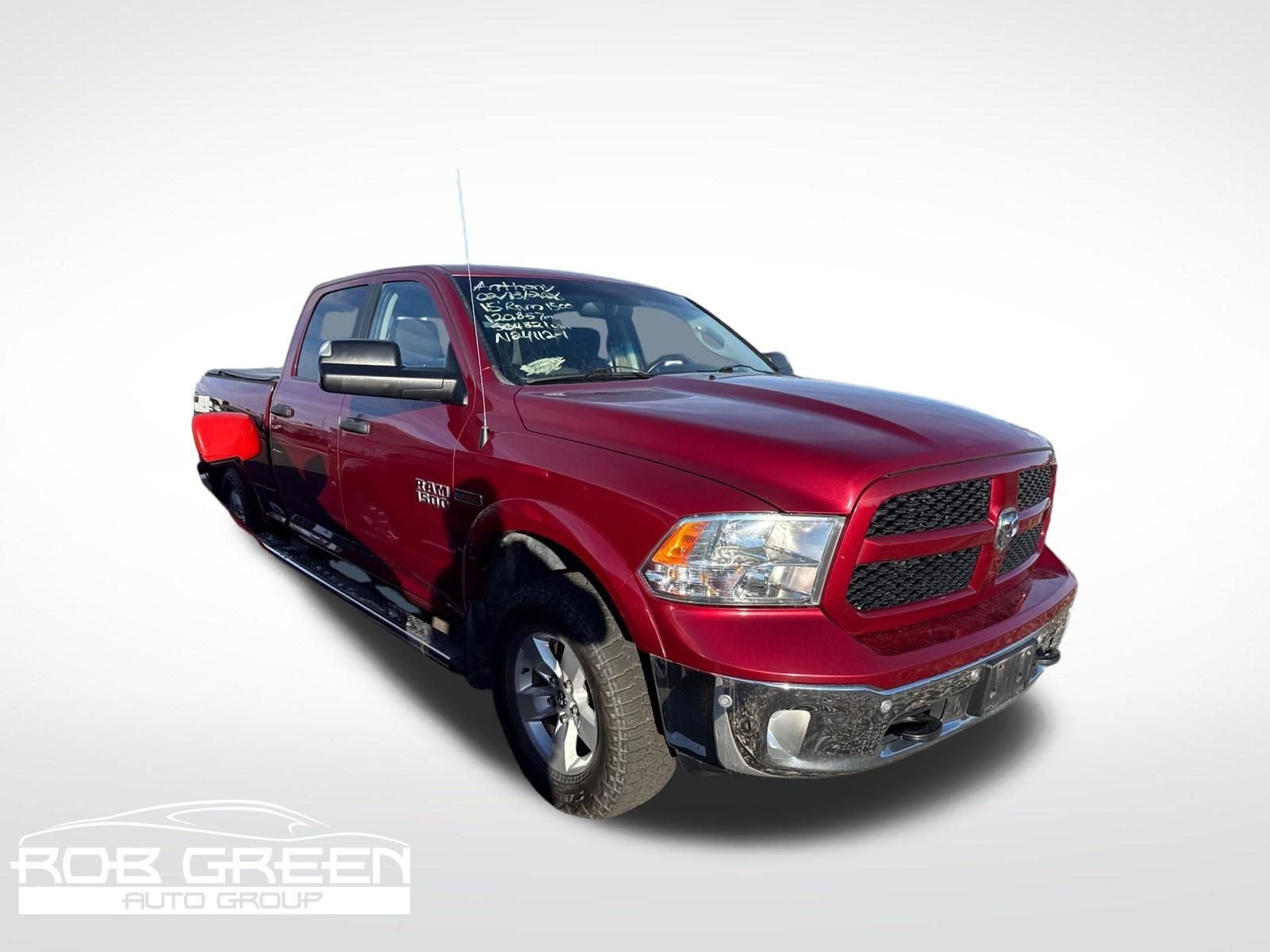 2015 RAM 1500 Outdoorsman in Deep Cherry Red Crystal Pearlcoat — front three-quarter view