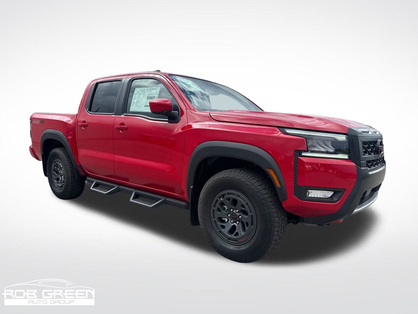 2026 Nissan Frontier PRO-4X in Red Alert — front three-quarter view