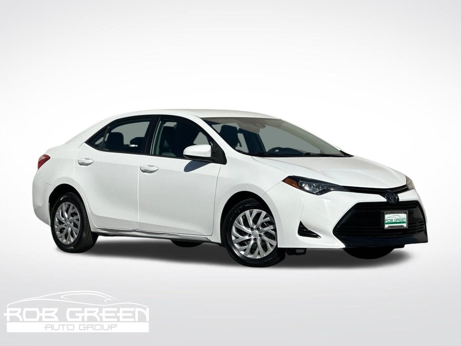 2019 Toyota Corolla LE in Super White — front three-quarter view