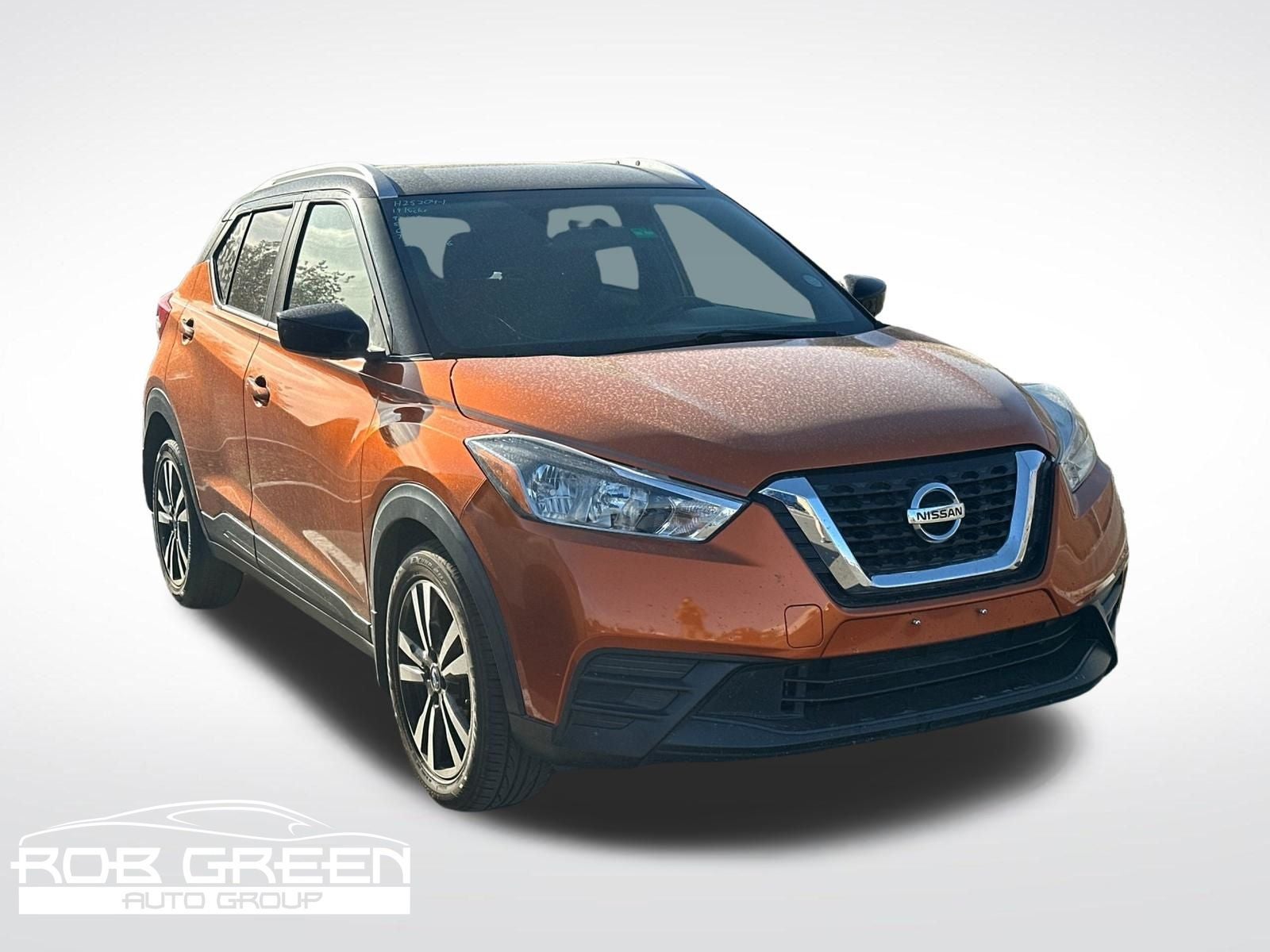 2019 Nissan Kicks SV in Monarch Orange/Super Black — front three-quarter view
