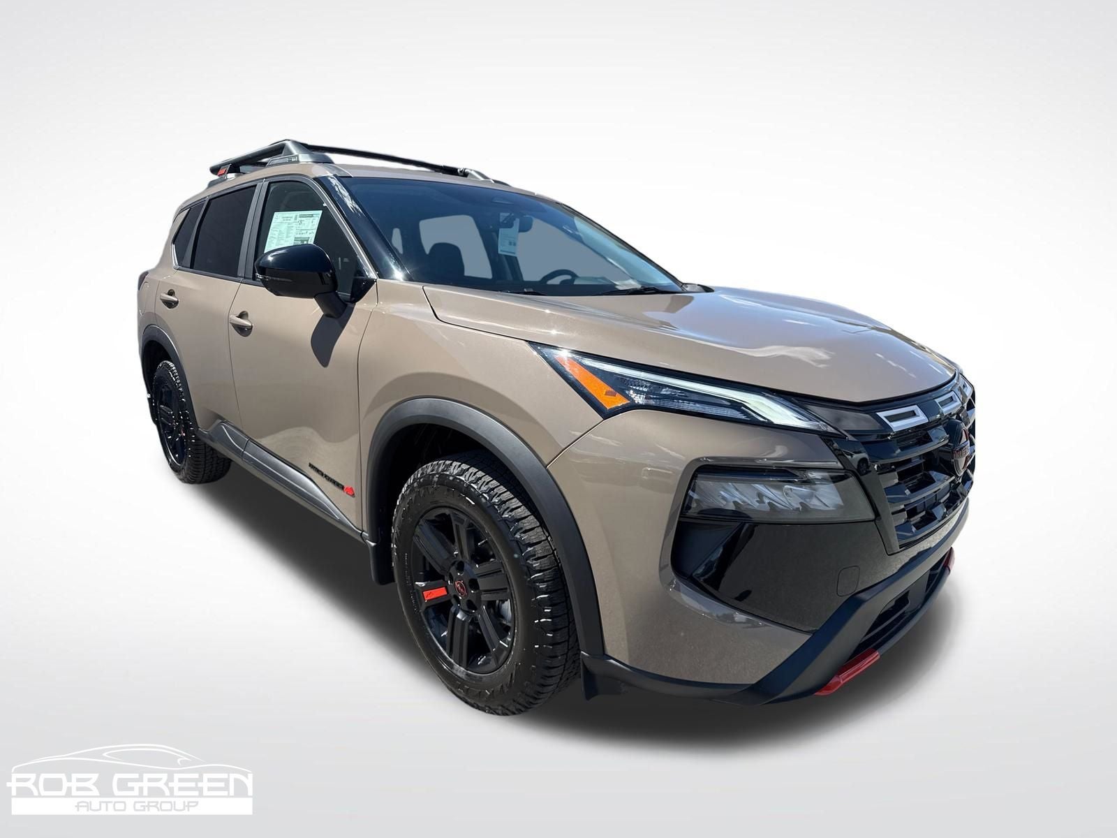 2026 Nissan Rogue Rock Creek in Baja Storm Metallic — front three-quarter view