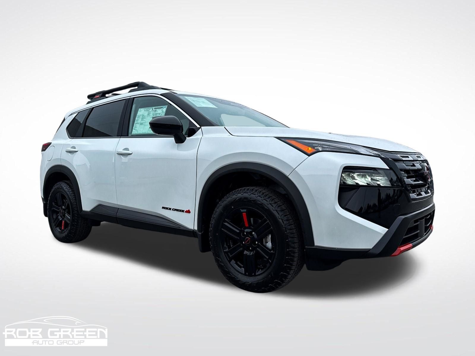 2026 Nissan Rogue Rock Creek in Everest White Pearl Tricoat — front three-quarter view