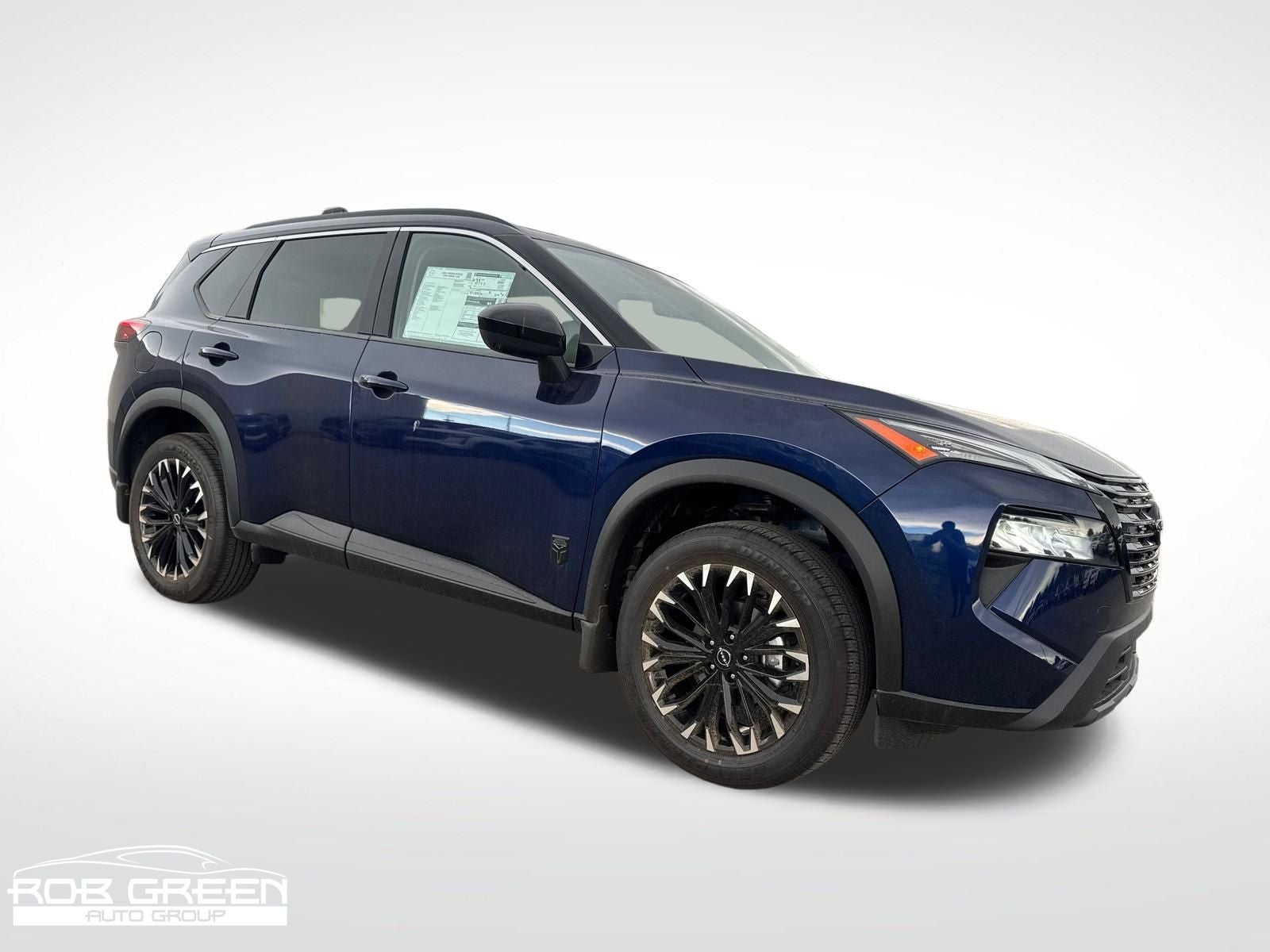 2026 Nissan Rogue Dark Armor in Deep Ocean Blue Pearl — front three-quarter view